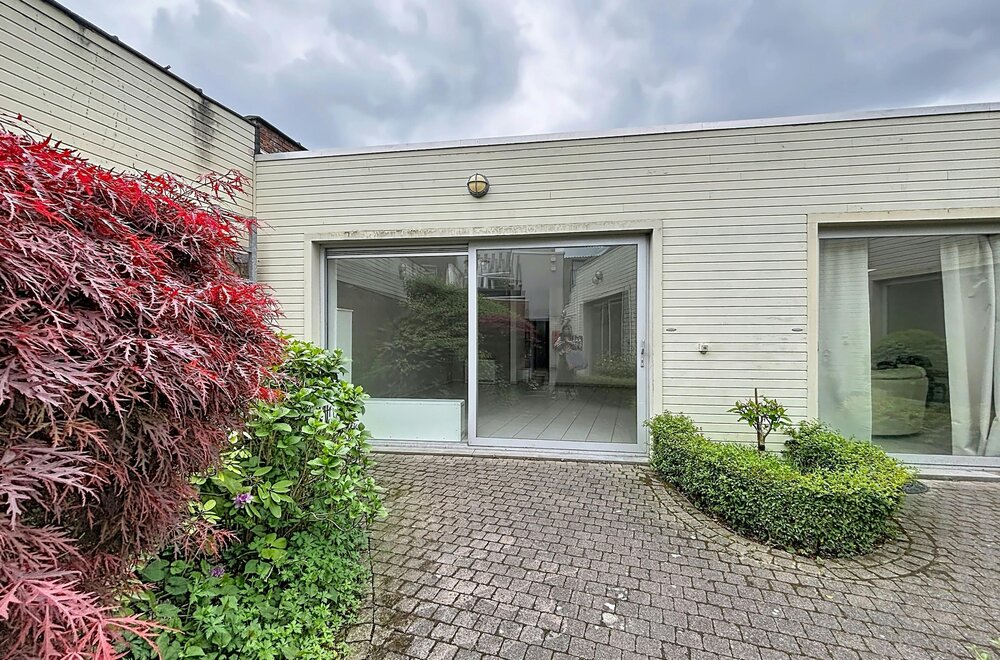 instapklaar-gelijkvloers-appartement-met-gemeenschappelijke-tuin-en-fietsenberging-in-hartje-kapellen-002.jpg