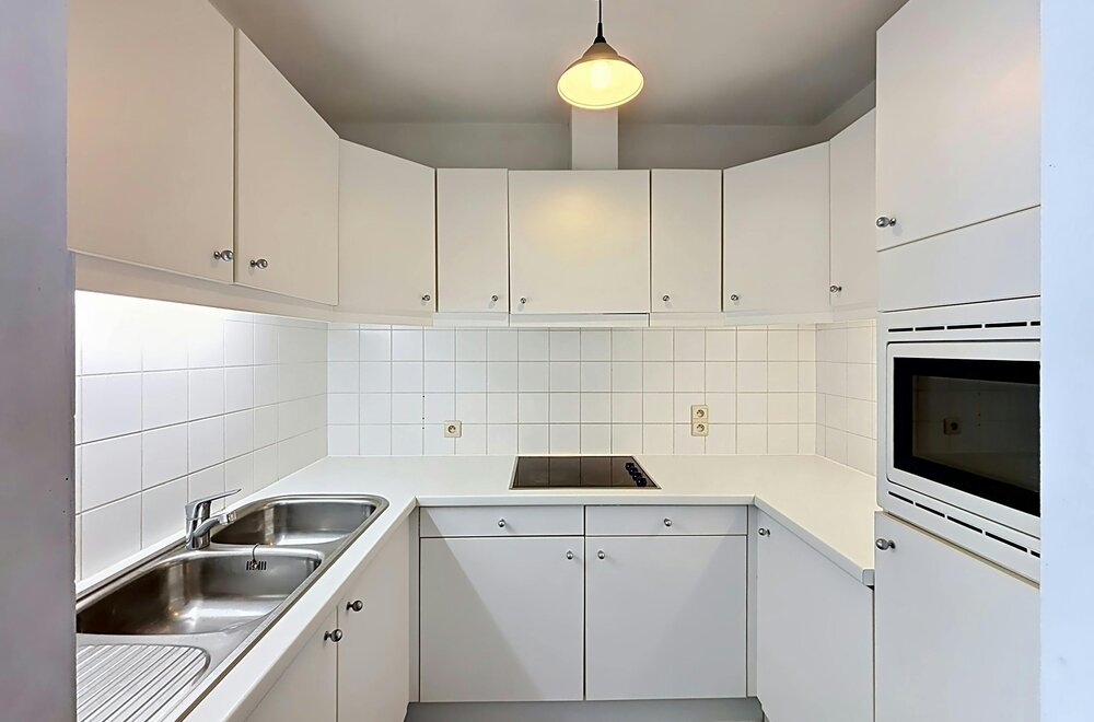 instapklaar-gelijkvloers-appartement-met-gemeenschappelijke-tuin-en-fietsenberging-in-hartje-kapellen-007.jpg
