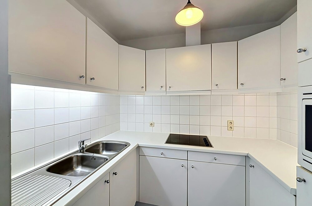 instapklaar-gelijkvloers-appartement-met-gemeenschappelijke-tuin-en-fietsenberging-in-hartje-kapellen-008.jpg