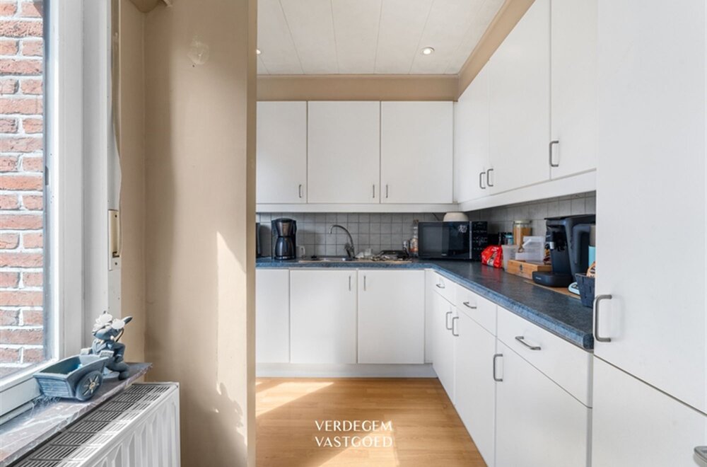 opbrengsteigendom-met-2-appartementen-en-4-garages-in-het-centrum-van-sleidinge-008.jpg
