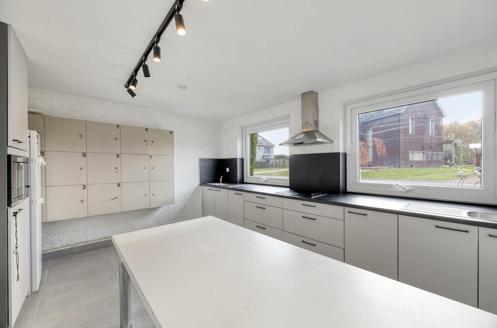 opbrengsteigendom-met-9-studentenkamers-en-duplex-appartement-te-hasselt003.jpg