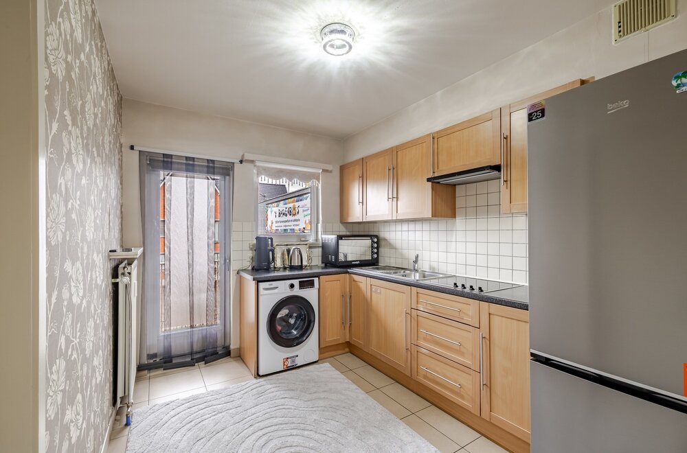 opbrengsteigendom-met-5-appartementen-en-5-garages-op-toplocatie-te-wetteren-007.jpg